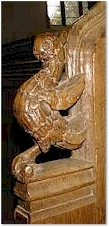 A bird on a bench end - St. Mary's, Old Hunstanton