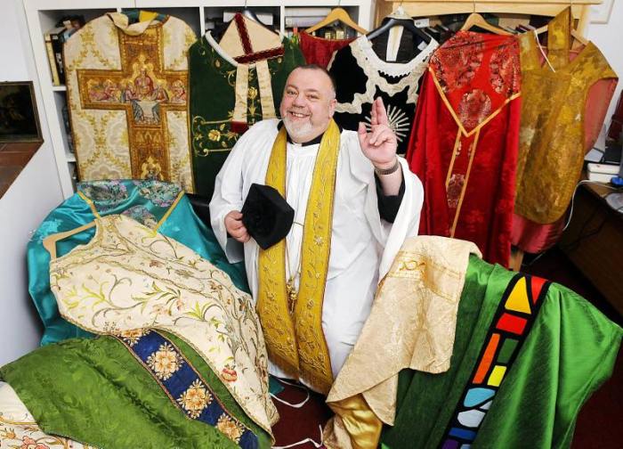 COLOURFUL COLLECTION:
The Rev. Christopher Wood
at The Rectory in Brancaster
with some of his collection of vestments. COLOURFUL COLLECTION:
The Rev. Christopher Wood
at The Rectory in Brancaster
with some of his collection of vestments.